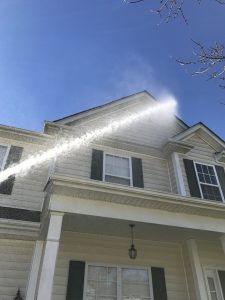 House Exterior Being Pressure Washed