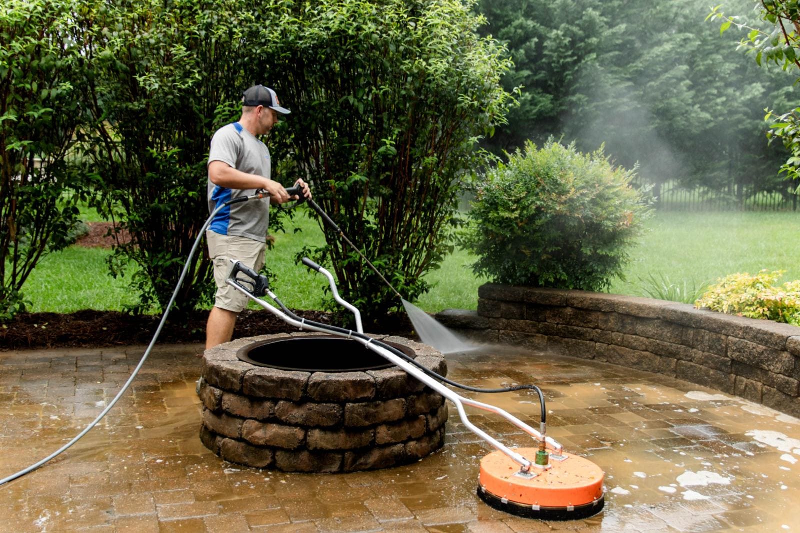 JB Power Clean pressure washing – worker cleaning patio area