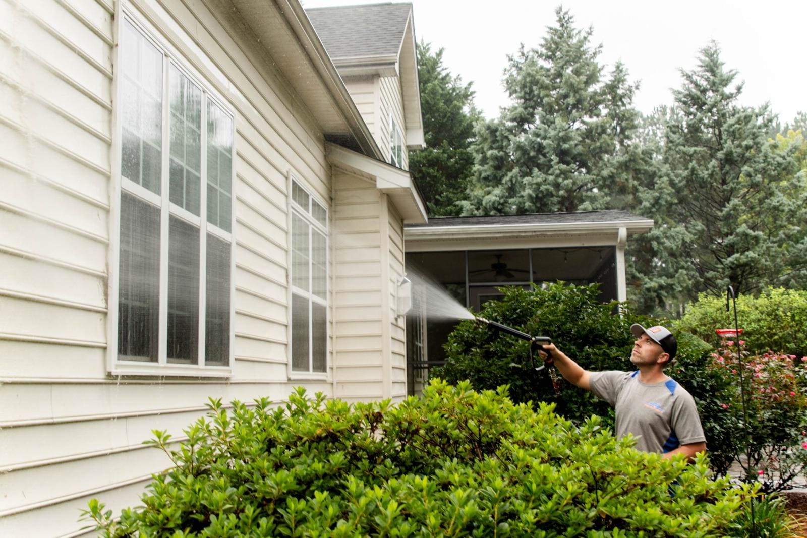 JB Power Clean technician performing pressure house washing