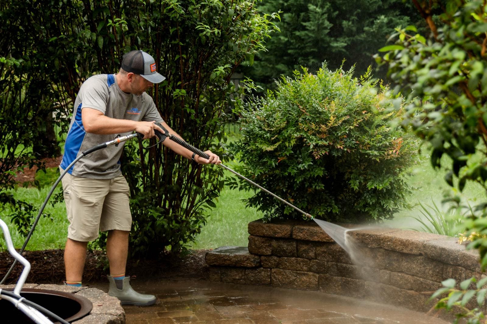 JB Power Clean technician performing pressure patio washing