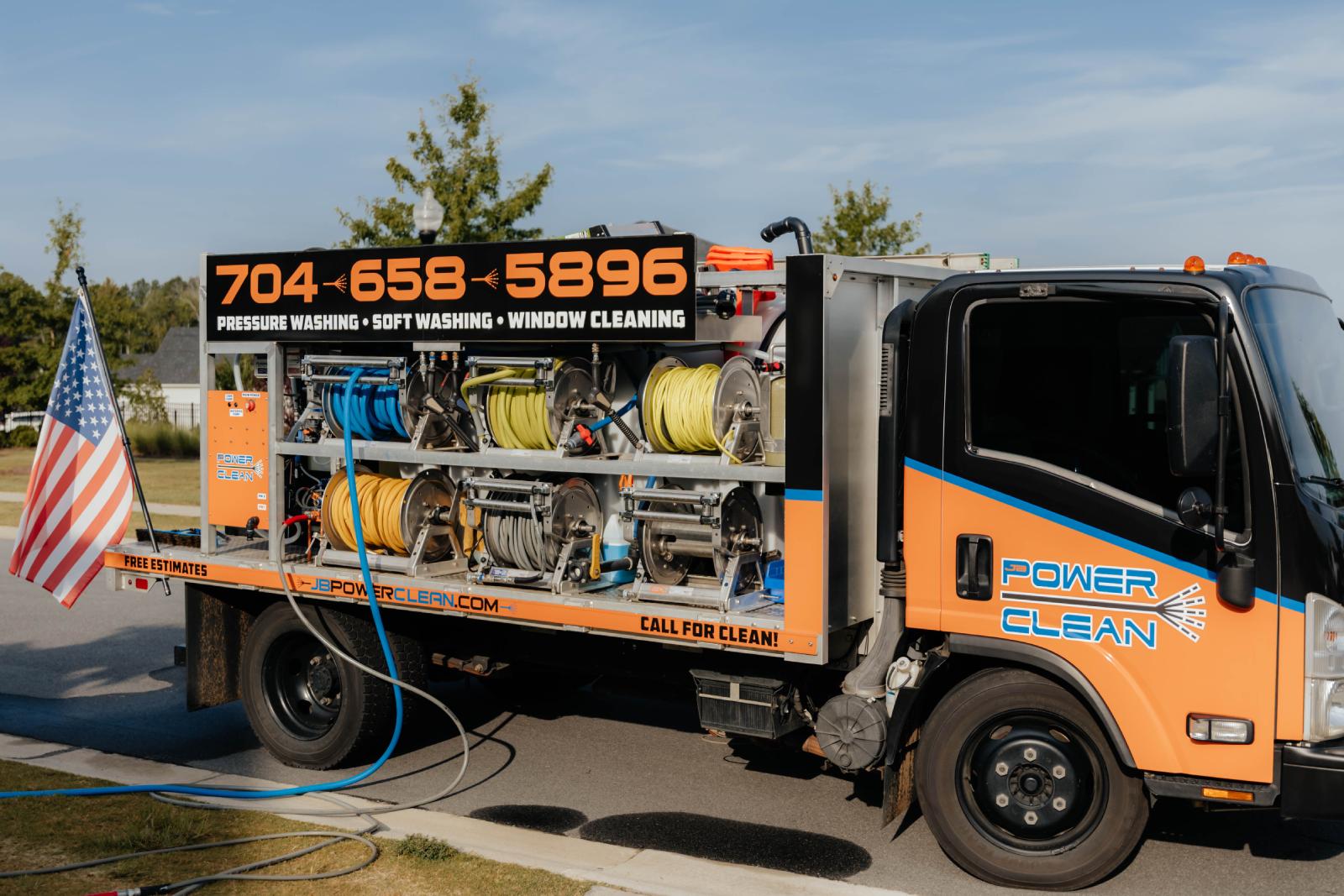 JB Power Clean commercial pressure washing – worker cleaning school grounds