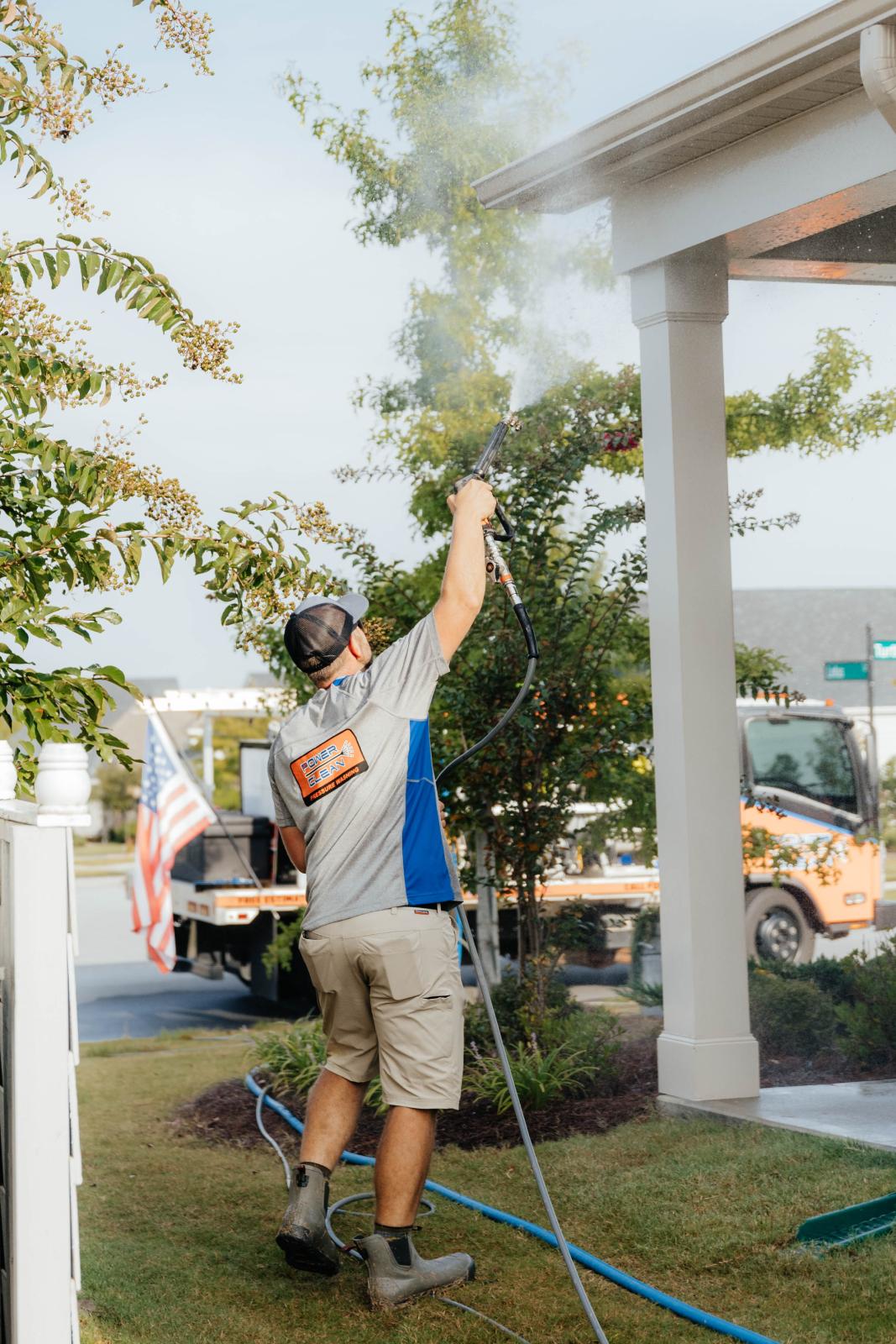 JB Power Clean technician performing professional gutter washing